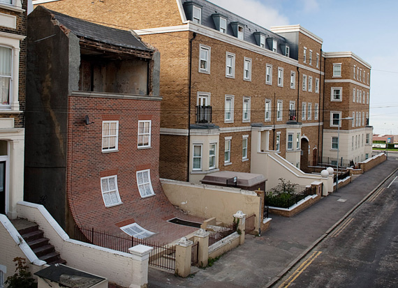 Sliding Brick House Installation by Alex Chinneck