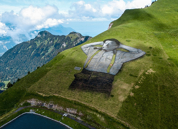 10,000 Square Meter Man Lying in The Grass by Saype